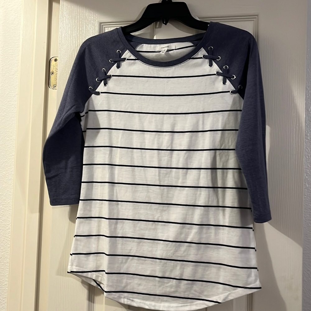 Maurice’s shirt X small. Black and white stripes with dark blue sleeves.